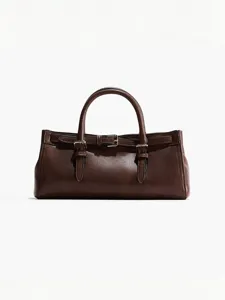 Dunkle braune Lederhandtasche Detailansicht mit eleganten Metallschnallen und klassischem Griff.