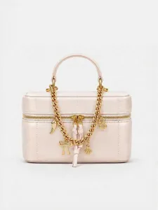 Chic pink leather vanity cosmetic bag featuring a bold gold chain strap and stylish metallic charms.