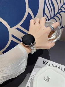 Elegante witte kattenoogsteen kralen horlogeband compatibel met Huawei horloge detail