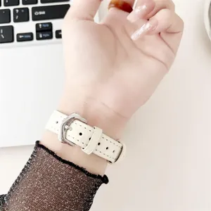 White leather watch strap detail view, vintage waist design, silver buckle, elegant smart band replacement.