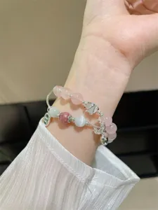 Charmant bracelet en cristal rose et pendentif lune, design elegant pour femmes quotidien.