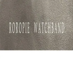 Detailed view of premium leather watch band texture with clear brand embossing for stylish looks.