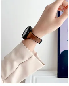 Close-up and detailed view of the brown genuine leather watch strap worn on the wrist.