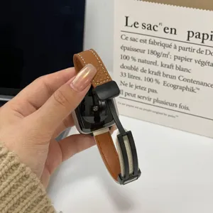 Detail view of replacement leather magnetic strap for Apple Watch, slim design, brown and white.