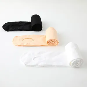 Detailed view of rolled kids dance tights in black, nude and white. Soft and stretchy ballet.