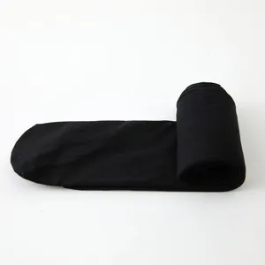 Kids 60D dance tights detail view, rolled black ballet leggings, stretchy footed hosiery.
