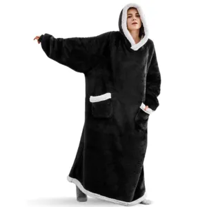 Oversized black wearable blanket hoodie detail, showing extra long sherpa lining and pockets.