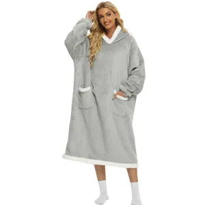 Detailed view of the extra-long grey wearable blanket hoodie with cozy white sherpa trim.