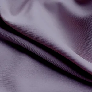 Elastic shapewear fabric detail close up showing soft texture and smooth purple knit surface.