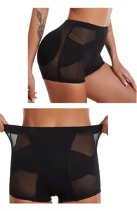 Close-up detail of black high-waist shapewear shorts showing mesh panels and stretch waistband.