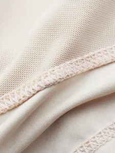 Detailed shot of breathable mesh shaping underwear fabric with fine stitching and elastic texture.