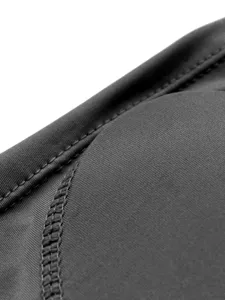 Detailed view of black shaping underwear fabric and double stitching craft for shapewear.