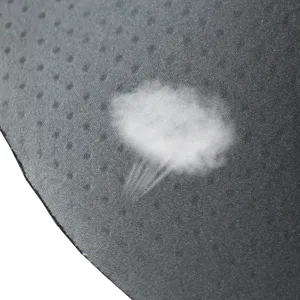 Close-up detail shot of breathable sponge shaping pad material with perforated texture.