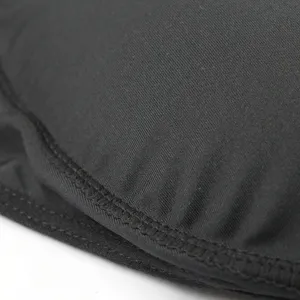 Men's shaping briefs fabric detail view, breathable black underwear texture close-up design.