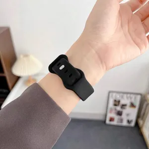 Detailed view of black silicone watch strap featuring secure wave buckle design for smartwatches.