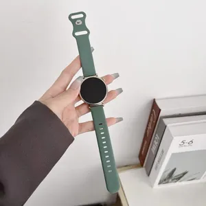 Detailed view of the dark green silicone smartwatch strap, flexible and comfortable for daily wear.