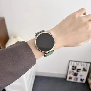 Smartwatch with green silicone strap and round metal case, stylish wrist wear for daily use.