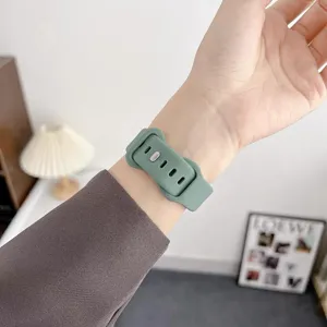 Detailed view of the soft silicone watch strap showing fine texture and comfortable wrist wear.