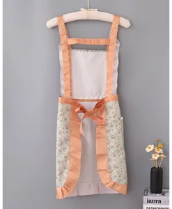 Cute pastoral floral kitchen apron with orange polka dot straps and pocket for women cooking.