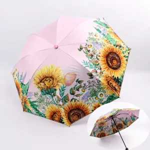 Pink double layer folding sun umbrella with beautiful sunflower print for outdoor UV protection.
