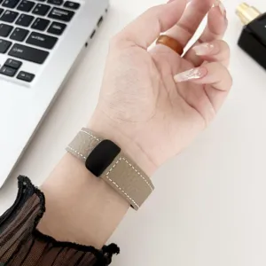 Leather watch strap with magnetic clasp for smart watch, elegant wrist accessory detail.