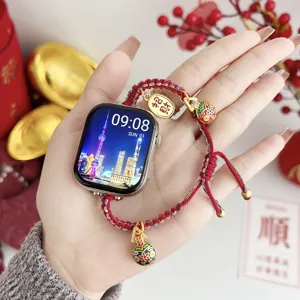 Chic red woven Apple Watch strap with lucky gold charms, festive replacement band.