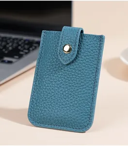 Compact blue leather card holder detail view, ultra-thin minimalist pocket wallet.