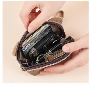 Leather coin purse detail showing large inner capacity for cards, cash, and keys.