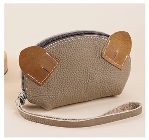 Mini genuine leather coin purse with cute animal ears design and convenient wrist strap.