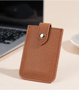 Brown leather card holder detail, slim minimalist wallet case, compact card pocket texture.
