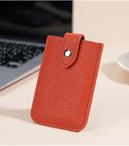 Compact orange genuine leather card holder with snap button closure. Slim mini card wallet case.