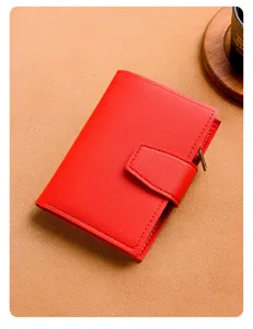 Red short trifold women wallet with card slots, zipper coin pocket and snap closure detail.