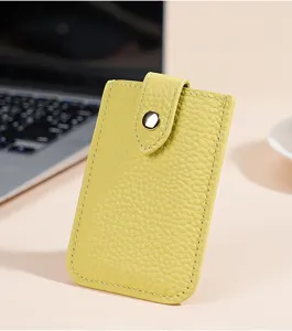 Detail view of the elegant compact yellow genuine leather card wallet and ID holder.