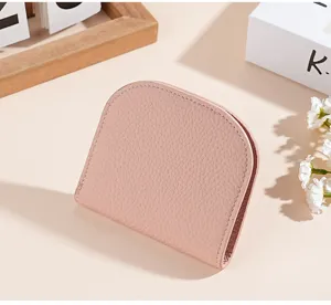 Compact genuine leather mini wallet for women, soft cowhide coin purse and card holder design.