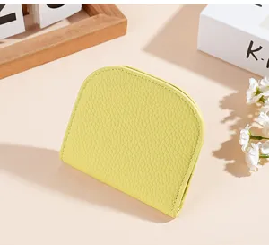 Compact yellow genuine leather mini wallet coin purse and card holder detail view style.