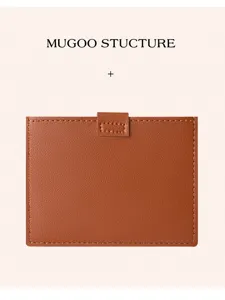 Detailed view of the brown leather card holder featuring neat stitching and secure snap closure.