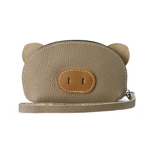 Cute brown leather pig coin purse miniature handbag front view daily storage item