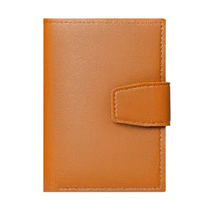 Brown leather short wallet for women, compact bifold card holder with snap closure, front view.