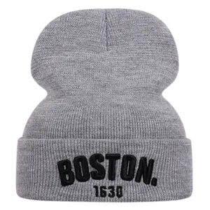 Detailed view of grey knit beanie hat with black embroidered BOSTON text and 1630 numbers.