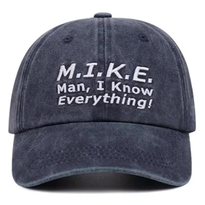 Detailed close-up of vintage washed cotton baseball cap featuring custom white embroidery text.
