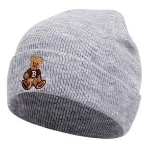 Grey knitted beanie hat for winter, featuring cute embroidered bear and letter design, warm casual cap.