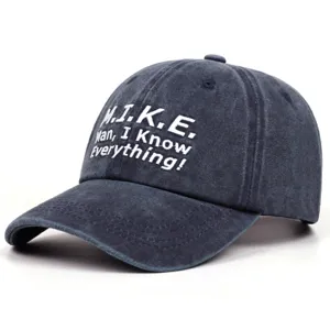Retro washed dark denim baseball cap front detail showing white embroidery letter pattern.