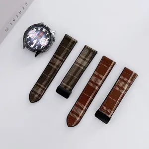 Detailed view of brown plaid tweed silicone smartwatch replacement bands with magnetic buckle.