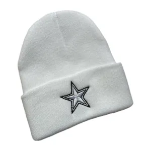 White knit beanie detail showing the embroidered star design and fine textured wool fabric.
