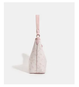Detailed side view of the pink and white cat print handbag tote, elegant and stylish design.