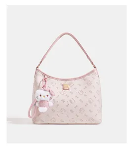Pink shoulder bag for women with cute cat plush charm, stylish hobo tote design for daily wear.