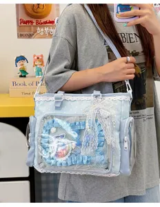 Borsa ita Lolita azzurra con finestra trasparente, rifinitura in pizzo e fiocchi decorativi.