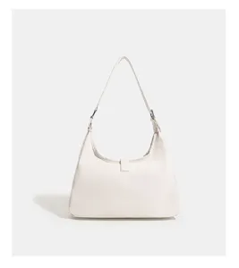 Minimalist white shoulder bag detail, stylish daily commute hobo purse with clean design.