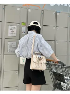 Stylish beige retro backpack detail, perfect for daily commute and fashion outfits.