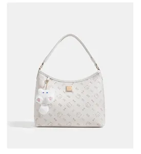 Elegant LUXE&KITTY white shoulder bag featuring cute cat patterns and plush pendant.
